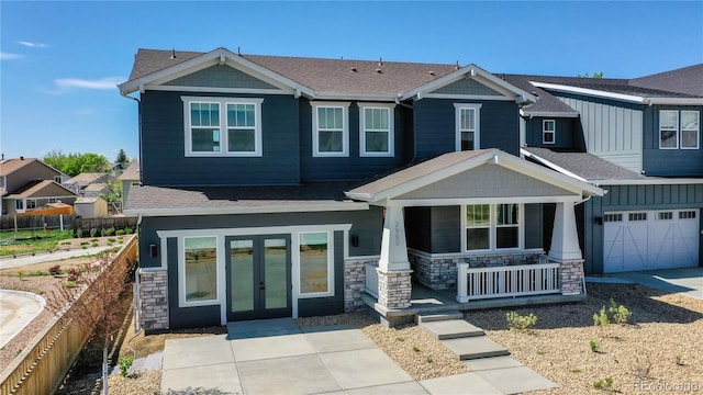 craftsman inspired home featuring a garage and covered porch