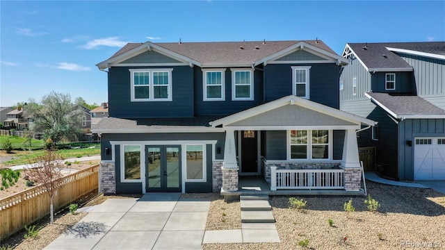 view of front of home with a porch and a garage