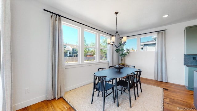 dining room with hardwood / wood-style floors