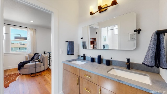 bathroom featuring vanity and hardwood / wood-style floors