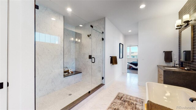 bathroom with tile patterned floors, vanity, and an enclosed shower