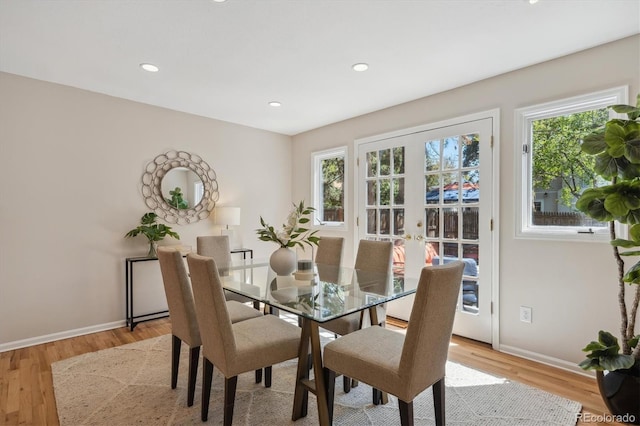 dining area featuring baseboards, light wood-style flooring, french doors, and recessed lighting