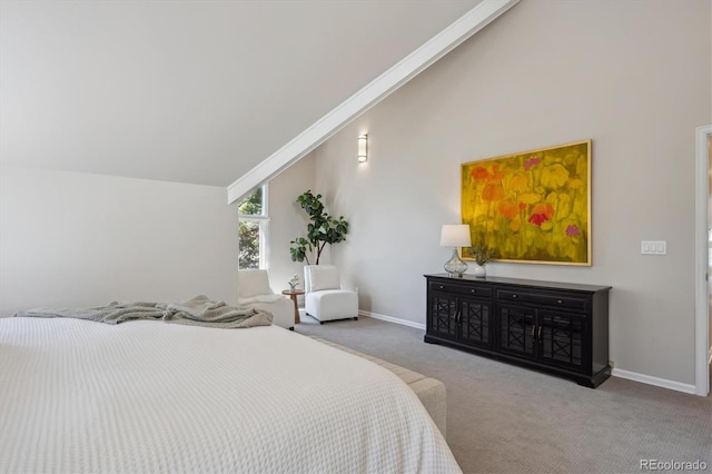 bedroom with carpet flooring, vaulted ceiling, and baseboards