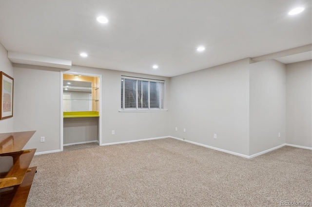 finished below grade area featuring carpet, recessed lighting, and baseboards