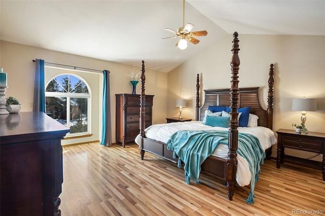 bedroom featuring ceiling fan, lofted ceiling, and light wood-type flooring