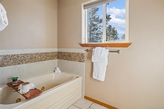 bathroom with a bath and tile patterned floors