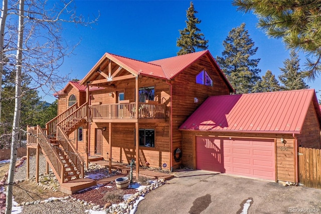 log-style house with a garage