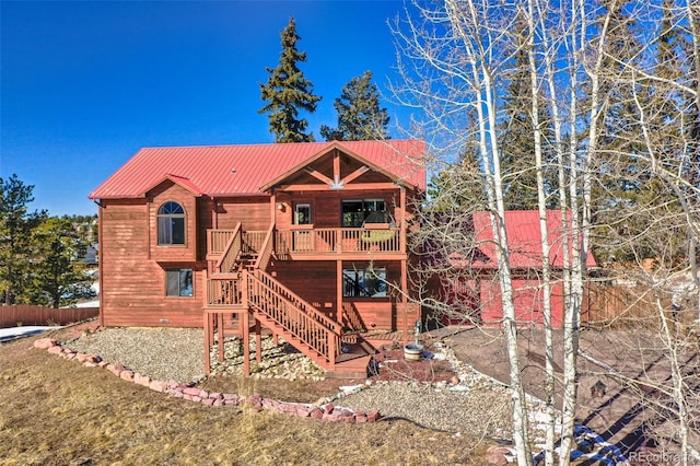 350 Panther Ct, Woodland Park, CO 80863 - back of house featuring metal roof, stairway, and fence