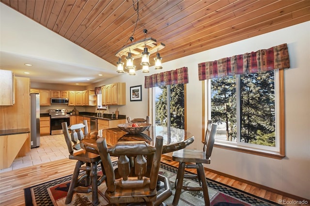 350 Panther Ct, Woodland Park, CO 80863 - dining area with lofted ceiling, recessed lighting, wood ceiling, baseboards, and light wood-style floors