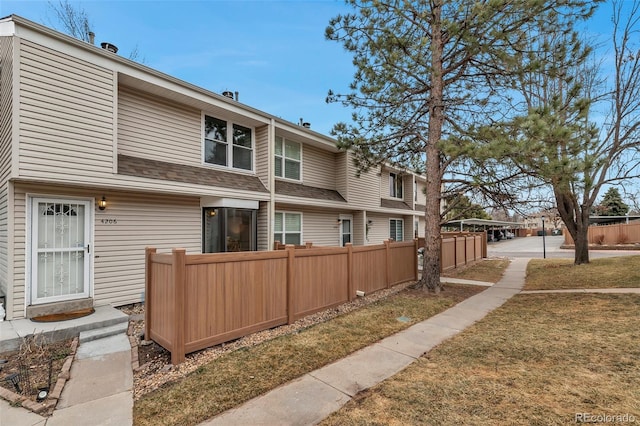 rear view of property with fence