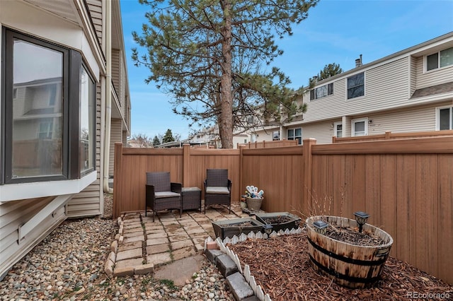 view of yard with a fenced backyard and a patio