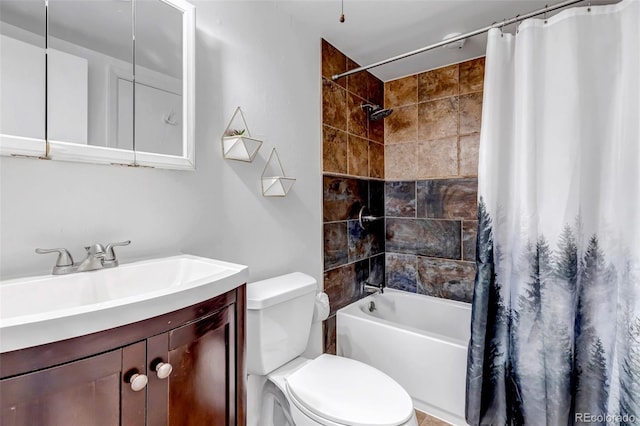 bathroom with shower / bath combo, vanity, and toilet