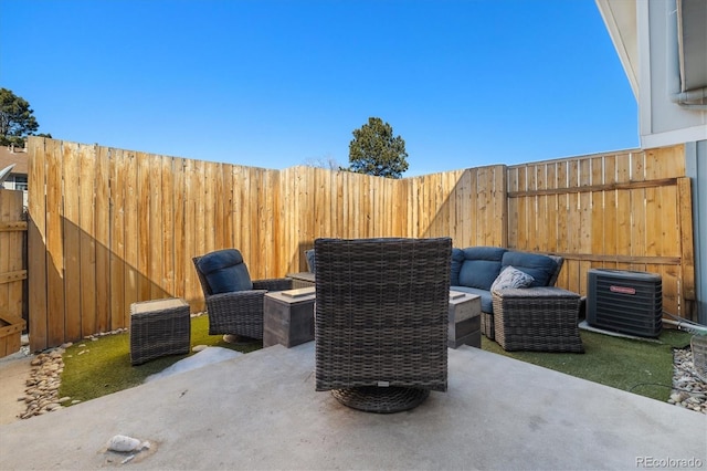 view of patio / terrace featuring central air condition unit and a fenced backyard