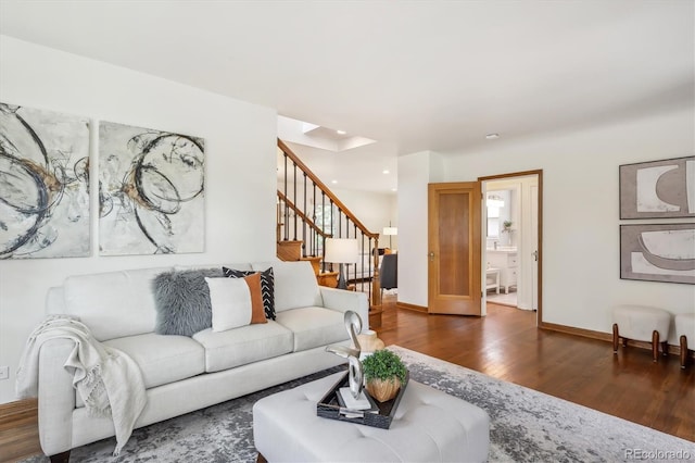 living room featuring dark wood-style floors, stairs, recessed lighting, and baseboards