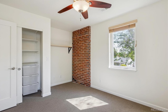 unfurnished bedroom with carpet floors, baseboards, a ceiling fan, and a closet
