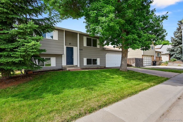 9196 W Maplewood Ave, Littleton, CO 80123 - view of front of house with driveway and a front lawn
