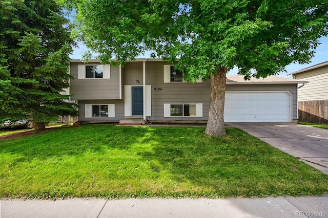 9196 W Maplewood Ave, Littleton, CO 80123 - bi-level home featuring driveway and a garage