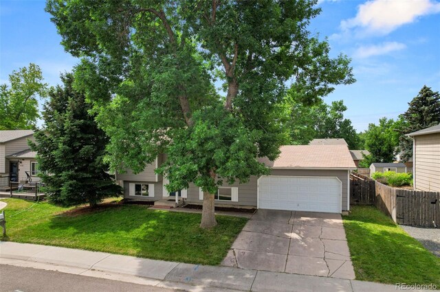 9196 W Maplewood Ave, Littleton, CO 80123 - view of front of house featuring concrete driveway and a garage