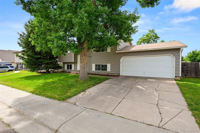 9196 W Maplewood Ave, Littleton, CO 80123 - view of front of house with a garage and driveway