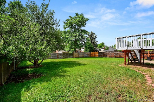 9196 W Maplewood Ave, Littleton, CO 80123 - fenced backyard with a deck and stairs