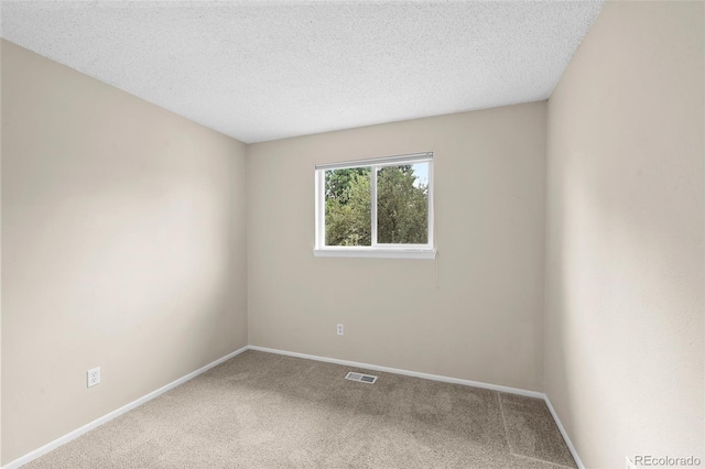 9196 W Maplewood Ave, Littleton, CO 80123 - carpeted spare room with baseboards and a textured ceiling