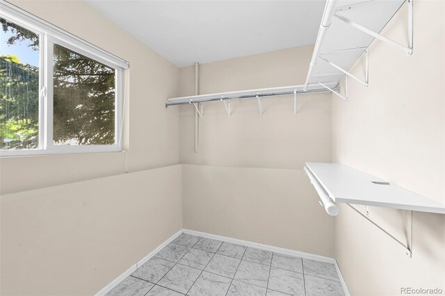 9196 W Maplewood Ave, Littleton, CO 80123 - walk in closet with light marble finish flooring