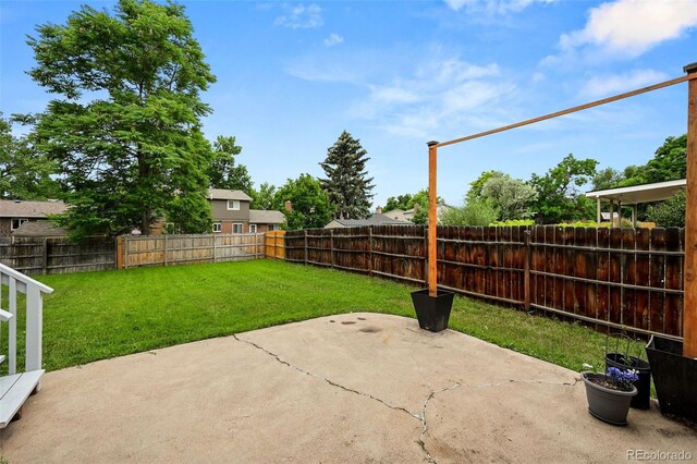 9196 W Maplewood Ave, Littleton, CO 80123 - fenced backyard featuring a patio area