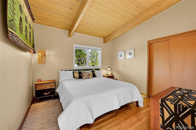 4701 Homestead St, Bow Mar, CO 80123 - bedroom featuring wooden ceiling with exposed beams, wood finished floors, and a closet