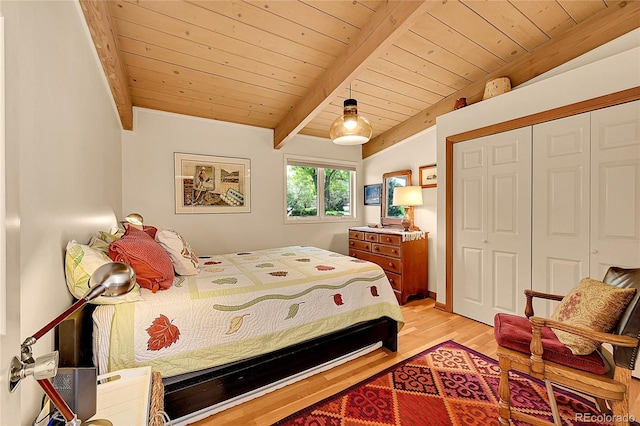 4701 Homestead St, Bow Mar, CO 80123 - bedroom featuring wooden ceiling with exposed beams, light wood-style flooring, and a closet