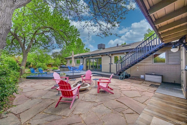 4701 Homestead St, Bow Mar, CO 80123 - view of patio with stairs, an outdoor fire pit, and a wooden deck