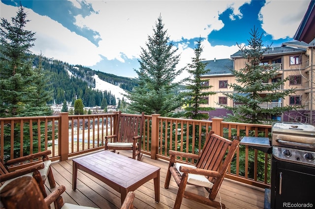 58 Hawk Cir Unit 2342, Dillon, CO 80435 - wooden terrace featuring a mountain view and grilling area