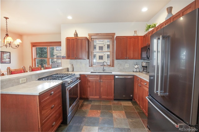58 Hawk Cir Unit 2342, Dillon, CO 80435 - kitchen with pendant lighting, a notable chandelier, sink, high quality appliances, and tasteful backsplash