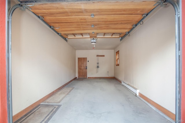 58 Hawk Cir Unit 2342, Dillon, CO 80435 - garage featuring a garage door opener and a baseboard heating unit