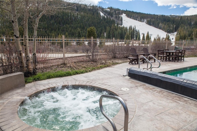 58 Hawk Cir Unit 2342, Dillon, CO 80435 - view of swimming pool with an in ground hot tub and a patio area
