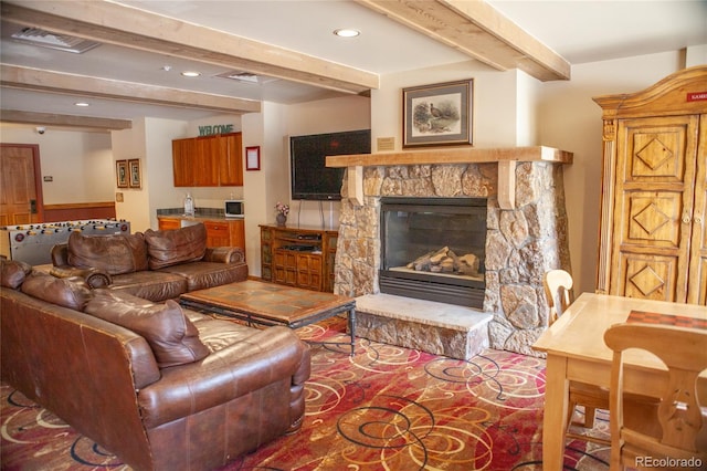 58 Hawk Cir Unit 2342, Dillon, CO 80435 - living room featuring a stone fireplace and beamed ceiling