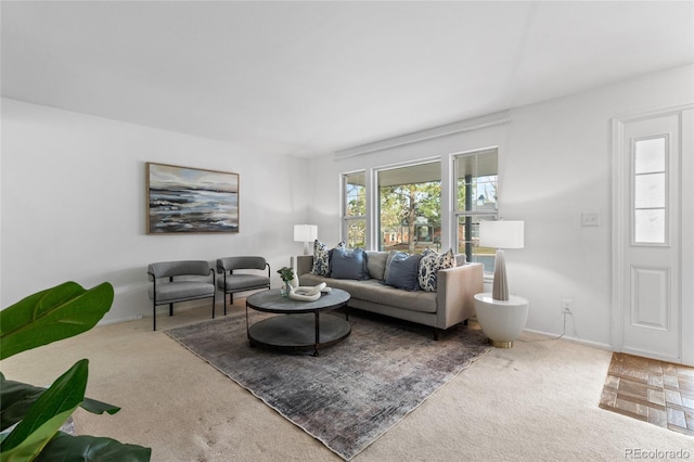 carpeted living room with baseboards