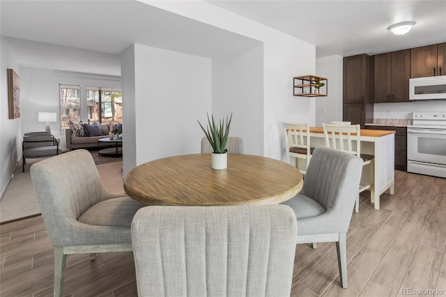 dining room with light wood finished floors