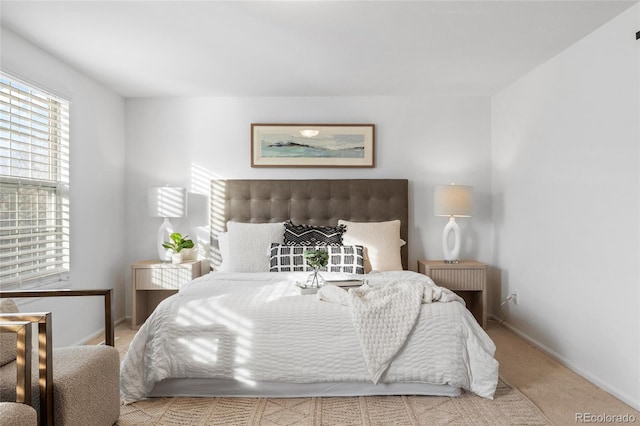 bedroom with carpet flooring and baseboards