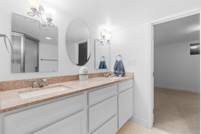 full bathroom featuring double vanity, baseboards, and a sink