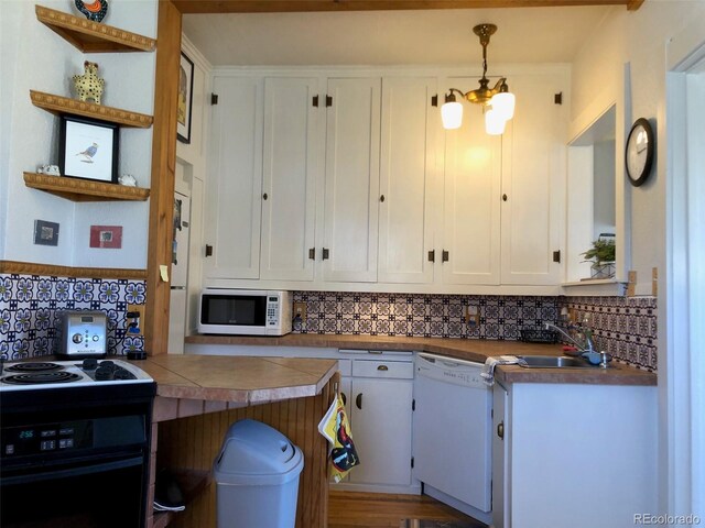 40 Bronk St, Monte Vista, CO 81144 - kitchen featuring white appliances, white cabinets, backsplash, open shelves, and hanging light fixtures