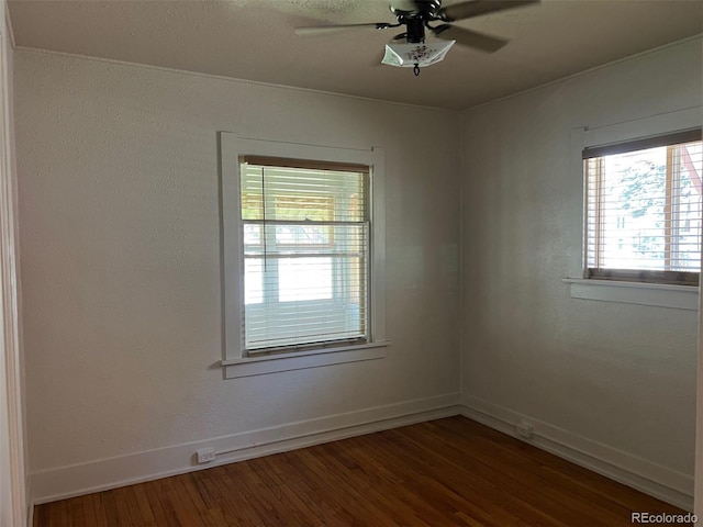 40 Bronk St, Monte Vista, CO 81144 - empty room with dark wood-type flooring and a ceiling fan