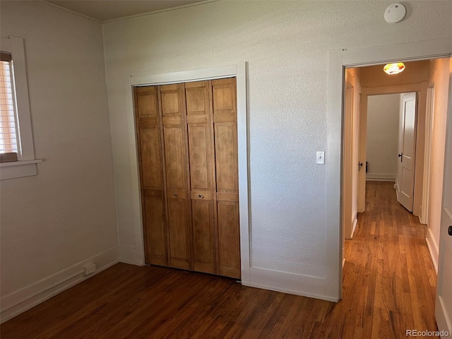 40 Bronk St, Monte Vista, CO 81144 - unfurnished bedroom featuring wood finished floors and a closet