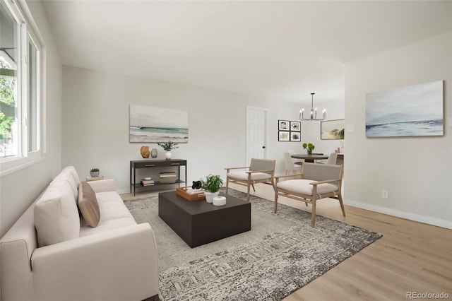 14544 March Dr, Denver, CO 80239 - living area featuring a chandelier and wood finished floors