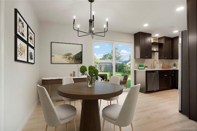 14544 March Dr, Denver, CO 80239 - dining space with a chandelier, light wood-style floors, and recessed lighting
