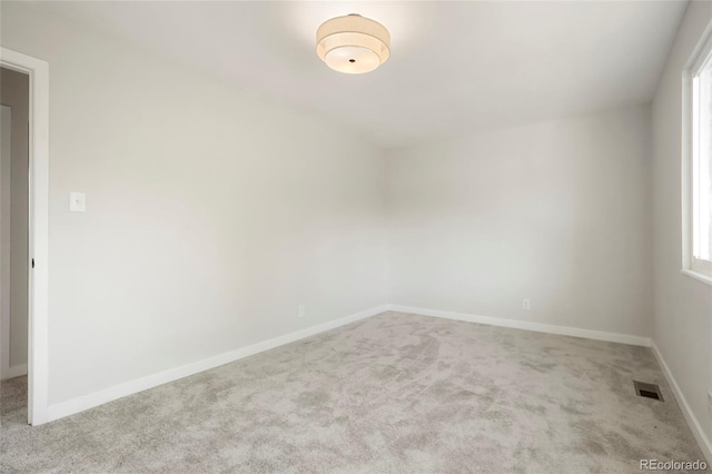 14544 March Dr, Denver, CO 80239 - carpeted spare room featuring baseboards