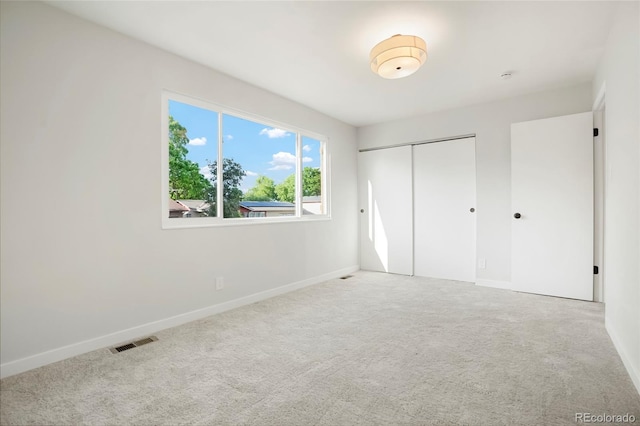 14544 March Dr, Denver, CO 80239 - unfurnished bedroom featuring carpet flooring and a closet