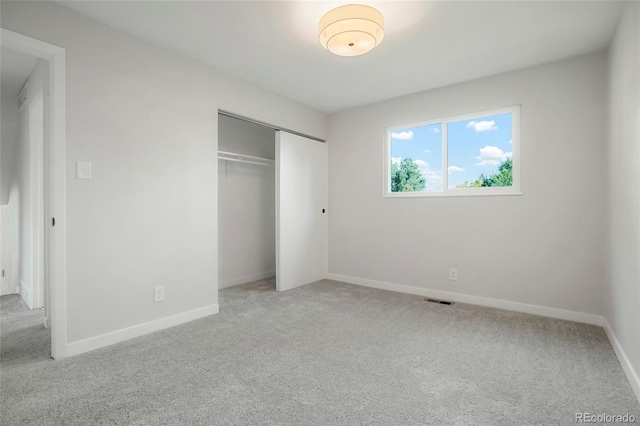 14544 March Dr, Denver, CO 80239 - unfurnished bedroom with light carpet and a closet