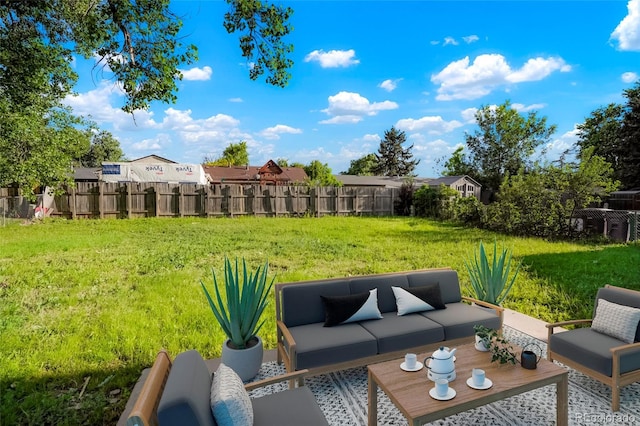 14544 March Dr, Denver, CO 80239 - fenced backyard featuring outdoor lounge area