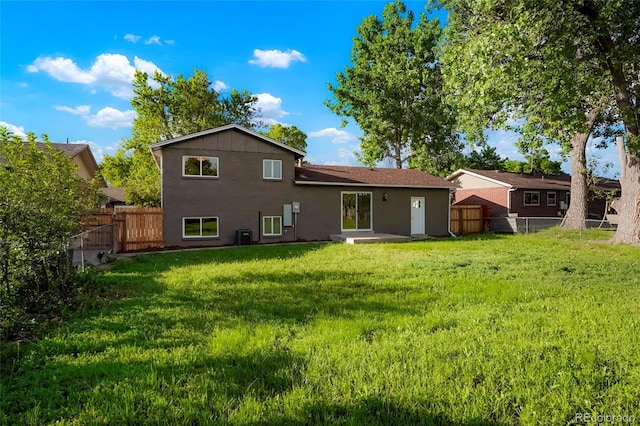 14544 March Dr, Denver, CO 80239 - rear view of house with a fenced backyard
