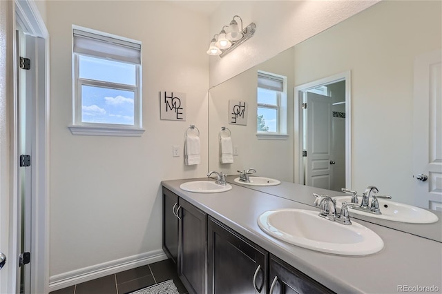 bathroom with plenty of natural light, tile patterned flooring, and vanity